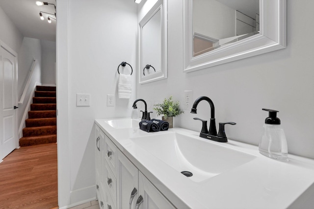 bathroom with wood-type flooring and vanity