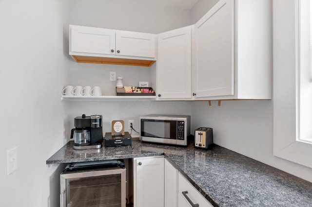 bar featuring white cabinets and wine cooler