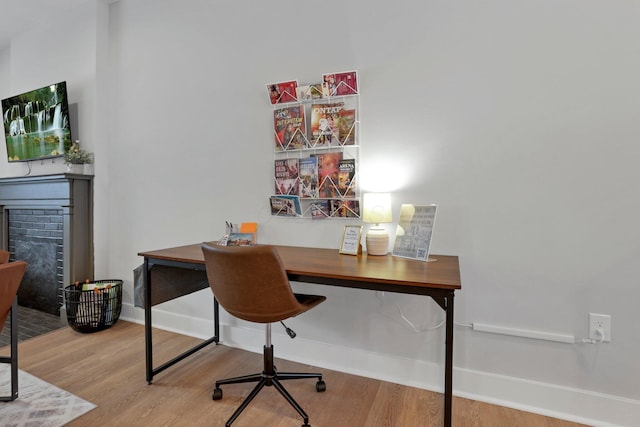 home office featuring hardwood / wood-style flooring