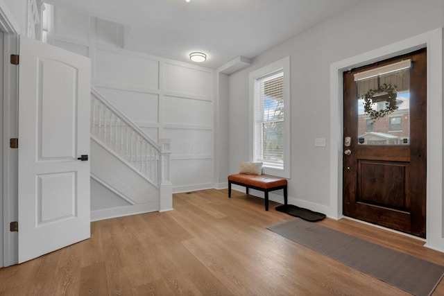 entryway with light hardwood / wood-style floors