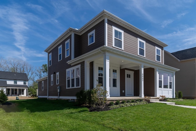 view of front of home with a front lawn and a porch