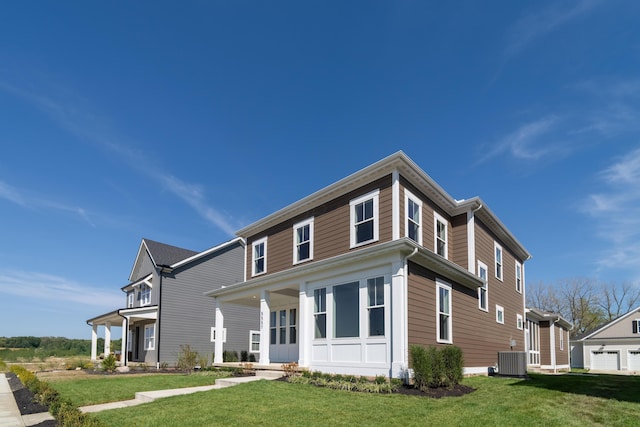 view of front of home with a front lawn and cooling unit