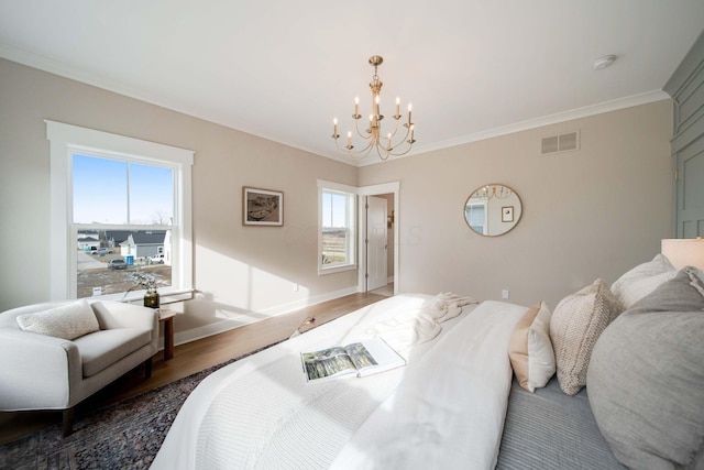 bedroom with a notable chandelier, dark hardwood / wood-style flooring, ornamental molding, and multiple windows