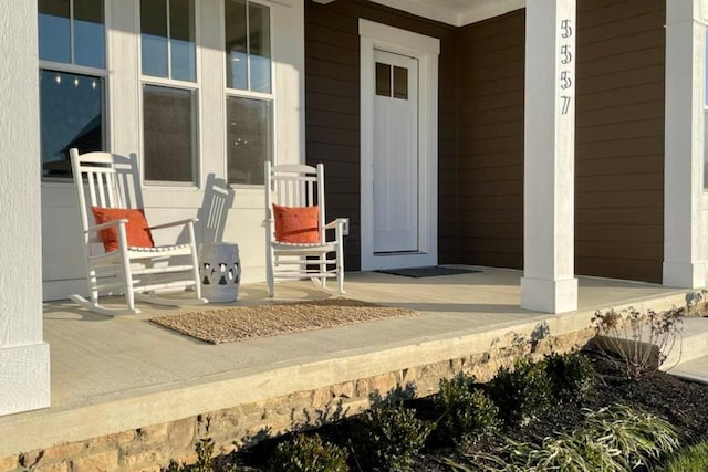 view of exterior entry with a porch