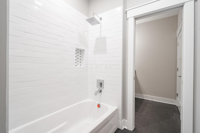 bathroom featuring tiled shower / bath combo and tile patterned floors