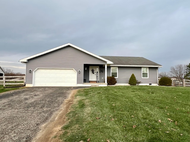 ranch-style house with a garage and a front lawn