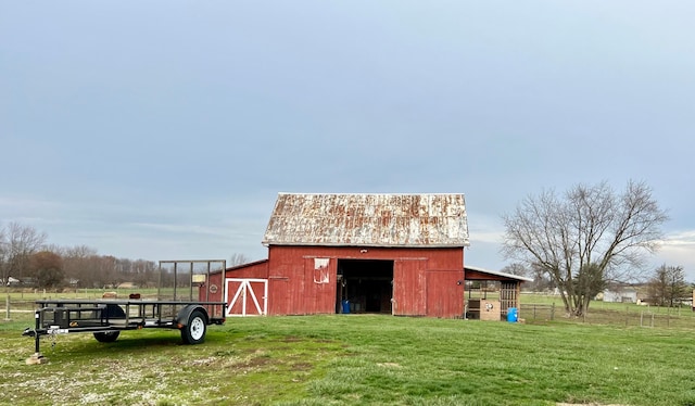 view of outbuilding featuring a lawn