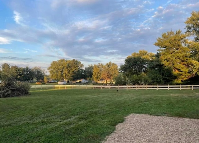 view of yard with a rural view