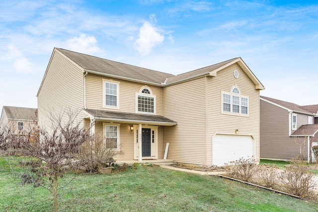 view of front of house with a garage and a front lawn