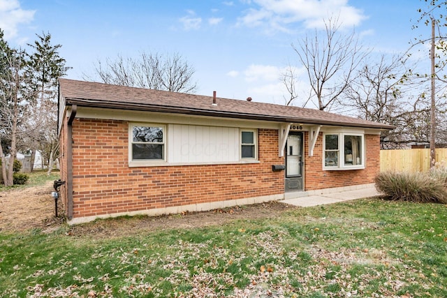 ranch-style house with a front lawn