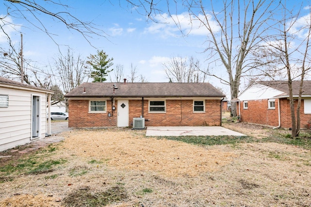 rear view of house with cooling unit and a patio