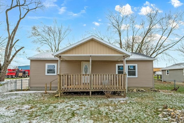 back of property with covered porch