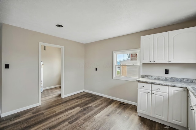 laundry area featuring dark hardwood / wood-style flooring