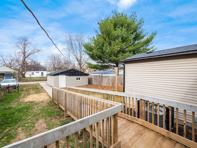 wooden deck with an outbuilding