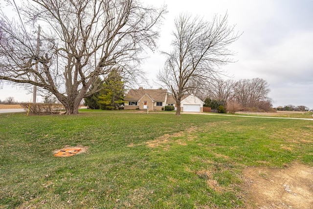 view of yard with a garage