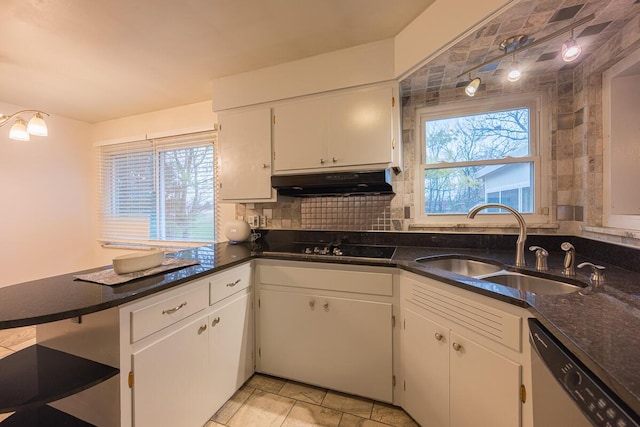 kitchen with decorative backsplash, dishwasher, and white cabinets