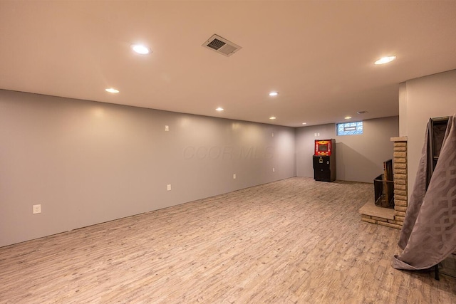 basement featuring light hardwood / wood-style floors