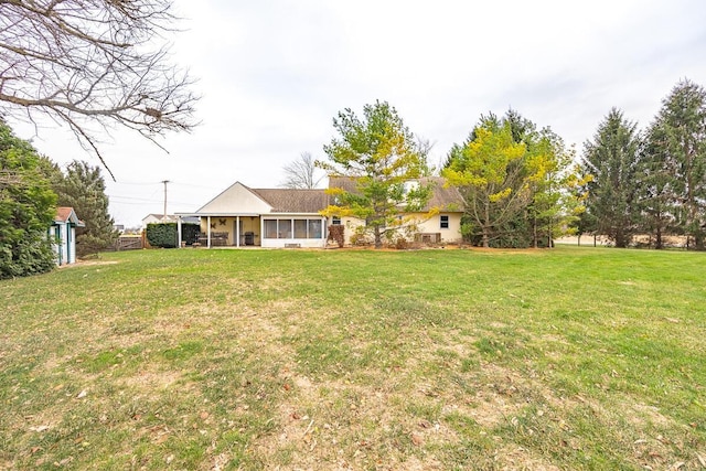 view of yard with a sunroom