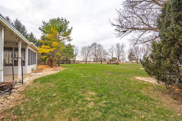 view of yard with a sunroom