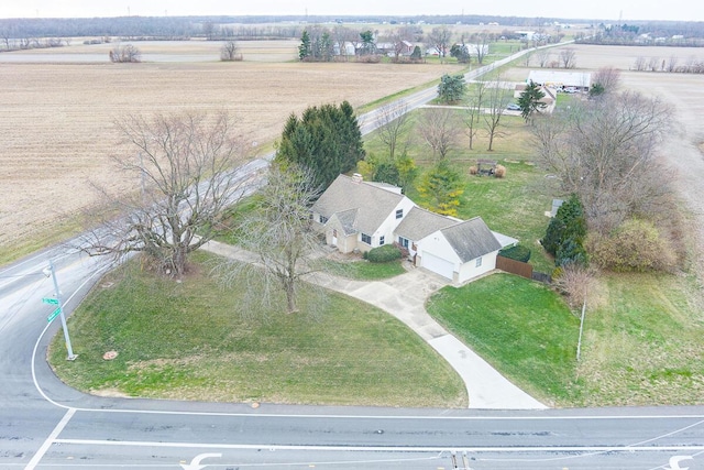 birds eye view of property with a rural view