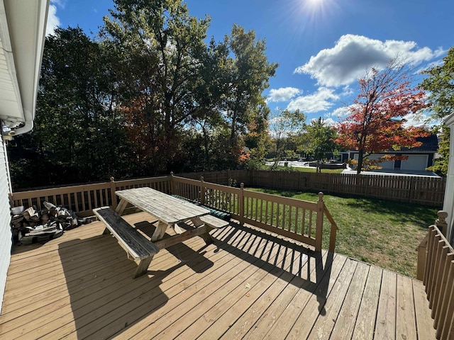 wooden terrace with a yard