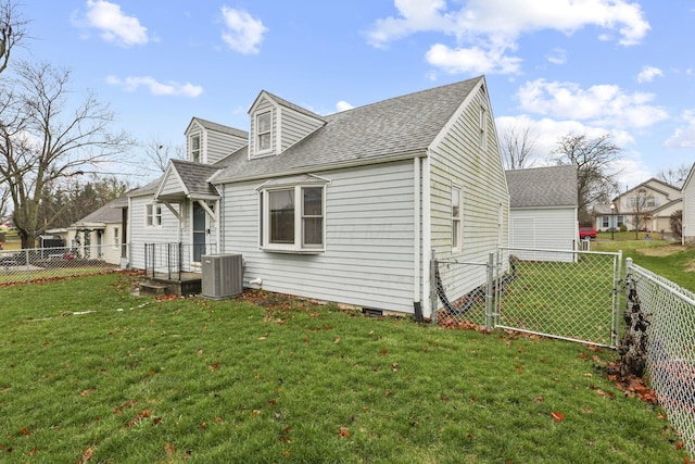 view of home's exterior featuring a yard and central AC