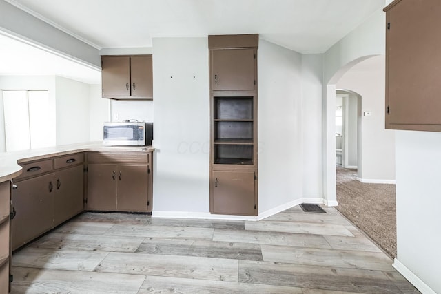 kitchen with light carpet