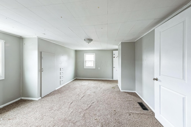 empty room featuring light colored carpet