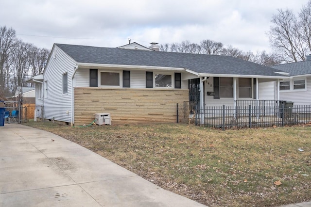 ranch-style home with a front yard