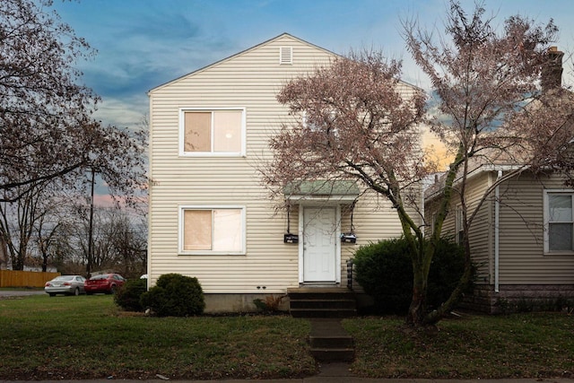 view of front of house with a lawn