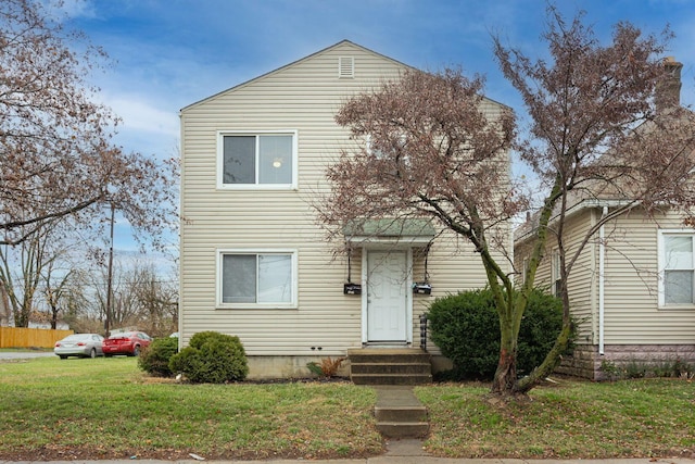 view of front of property with a front lawn