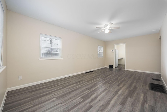 unfurnished room with ceiling fan and dark wood-type flooring