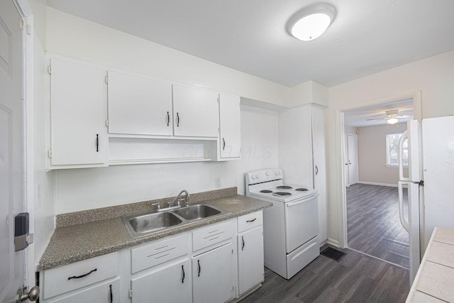 kitchen with white appliances, white cabinets, sink, ceiling fan, and dark hardwood / wood-style flooring