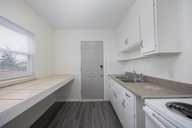 kitchen featuring white electric range oven, white cabinetry, sink, and dark wood-type flooring