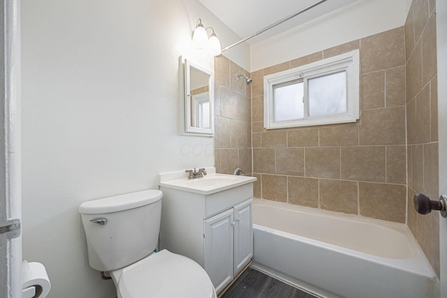 full bathroom featuring toilet, vanity, tiled shower / bath combo, and hardwood / wood-style flooring