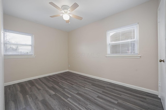 unfurnished room featuring ceiling fan and dark wood-type flooring