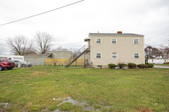 view of property exterior with a yard