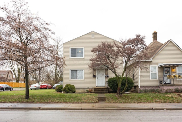 view of front of property with a front lawn