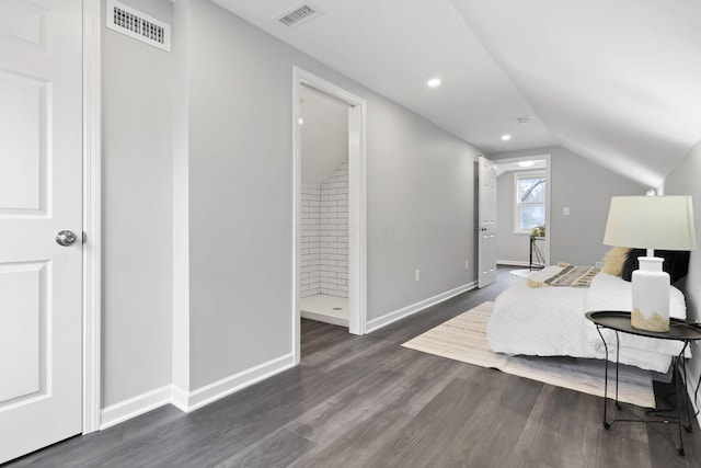 bedroom with dark hardwood / wood-style floors and vaulted ceiling