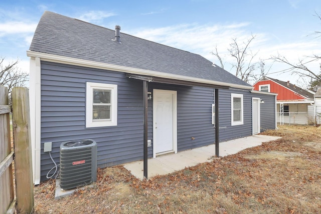 back of property with central air condition unit