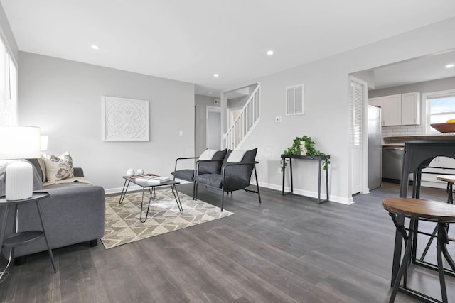 living room with dark hardwood / wood-style floors