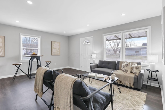 living room with dark hardwood / wood-style flooring