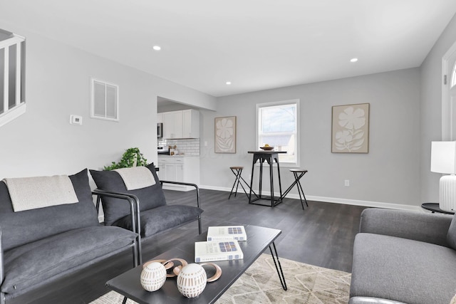 living room featuring dark hardwood / wood-style floors