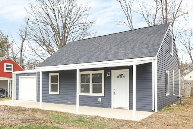 view of front of home featuring covered porch and a garage