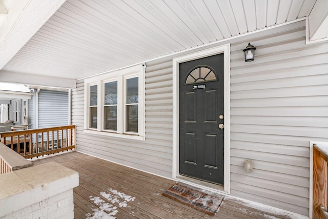 doorway to property featuring covered porch