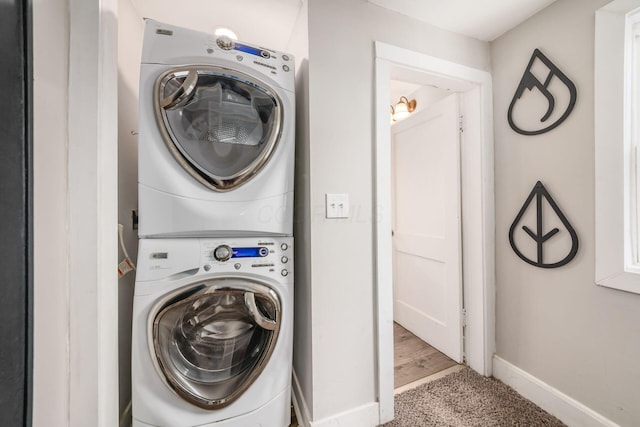 washroom with stacked washer and dryer