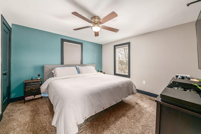 bedroom featuring dark carpet and ceiling fan