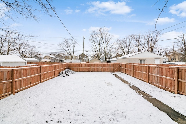 view of yard covered in snow