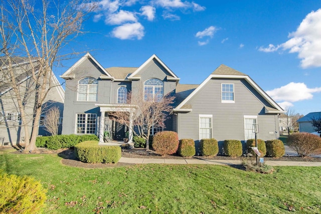 front facade with a front yard