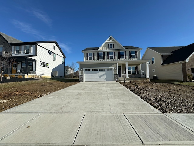 view of front facade featuring covered porch and a garage